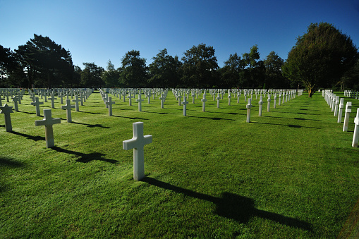 White Crosses For Fallen US Soldiers At The American Cemetery In Normandy France On A Beautiful Sunny Summer Day With A Clear Blue Sky