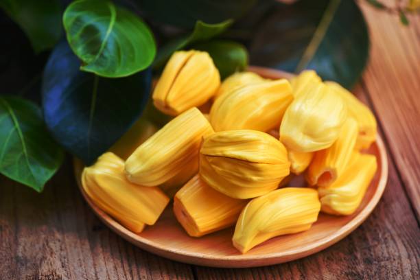 istock Ripe jackfruit peeled tropical fruit fresh from jackfruit tree, jackfruit on wooden plate with leaf on background 1462711607
