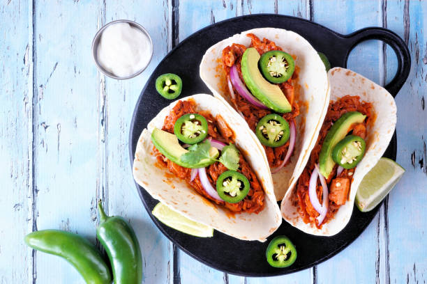 istock Jackfruit vegan taco table scene on a blue wood background 1462711834