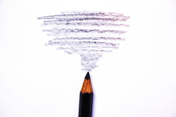 istock wooden crayon texture with cyan black drawings on white paper 1462715075