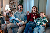 Happy family enjoying on the sofa