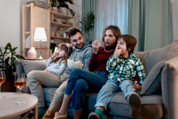 istock Family watching TV 1462716672
