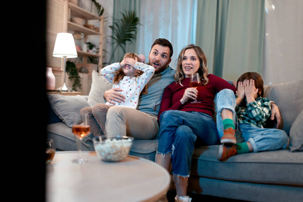 istock Family watching something scary on the TV 1462718311