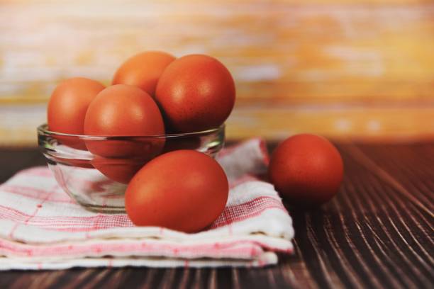 istock Fresh egg bowl on tablecloth on the wooden table background - Raw chicken eggs collect from the farm products natural eggs for food 1462719241