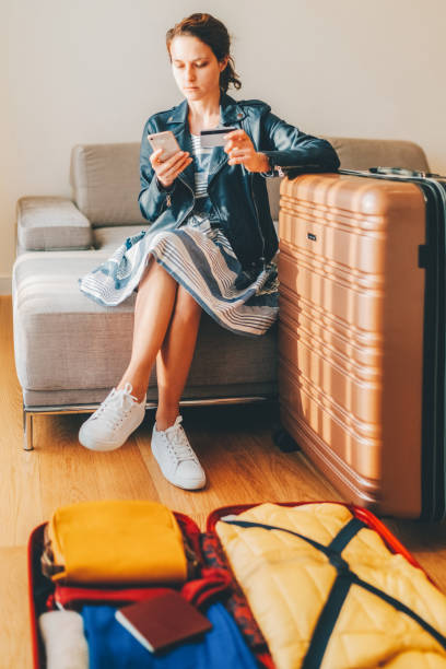 istock Tourist in hotel room flight reservations 1462720950