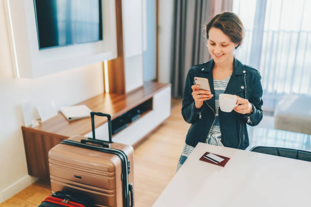 istock Tourist in hotel room flight reservations 1462721815