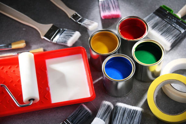 istock Paintbrushes of different size and paint cans 1462722962