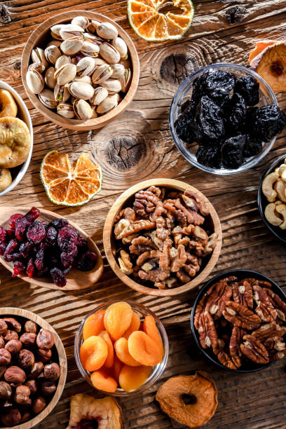 istock Composition with a variety of dried fruits and assorted nuts. 1462723394