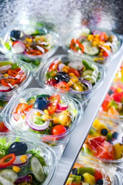 istock Boxes with pre-packaged vegetable salads in a commercial fridge 1462723499