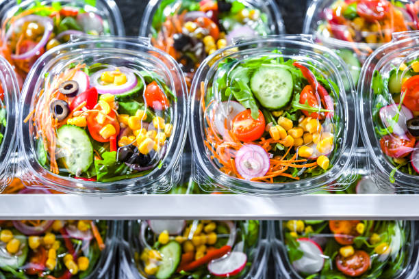 istock Boxes with pre-packaged vegetable salads in a commercial fridge 1462724018
