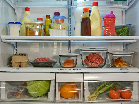 In the fridge, there are: Vegetables, meat, fish, eggs, milk, banh chung on Tet holiday and some other fruits and vegetables