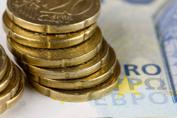 istock Euro-cent coins on note, EUR money 1462727752