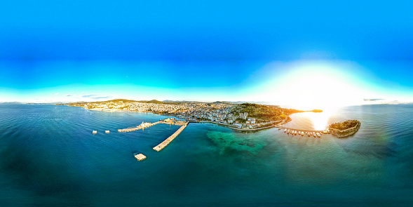 Kusadesi city panoramic view from the sea. Drone shooting. The most important tourism and holiday region of the Aegean Sea. Blue sea, harbor and city view.