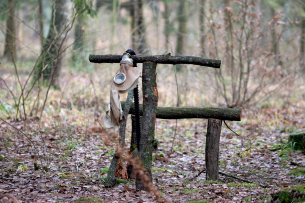 Gas mask in the forest. Prop in the forest near the agritourism farm in Koryciny, Poland
