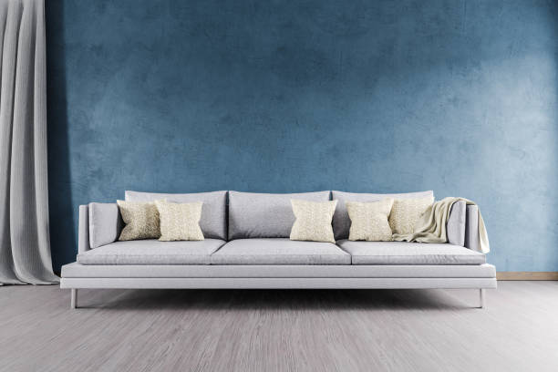 istock minimalistic modern elegant living room interior with single vintage sofa in front of blue wall, shelf and white carpet; copy space and empty canvas; 3D Illustration 1462745032
