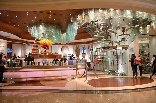 Las Vegas, Nevada, USA - November 3, 2022: The Bellagio Patisserie is a confectionary store in the Bellagio Hotel with a 27-foot-tall fountain of cascading chocolate.