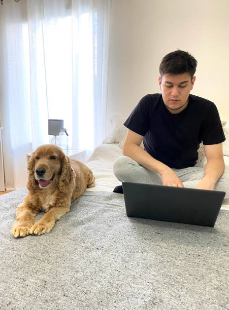 istock young man with pet by his side 1462759808