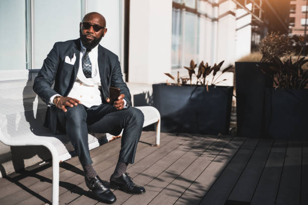 istock Elegant african man sits on a bench 1462766903