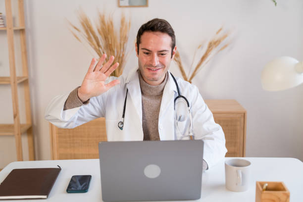 istock Cheerful doctor making video call 1462774210