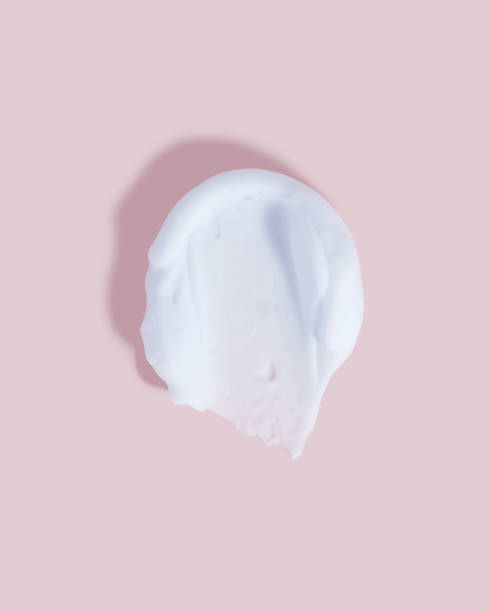 istock Blue foam smear on pink background. 1462775213