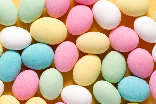 istock Pile of sweets on yellow background, top view 1462775858