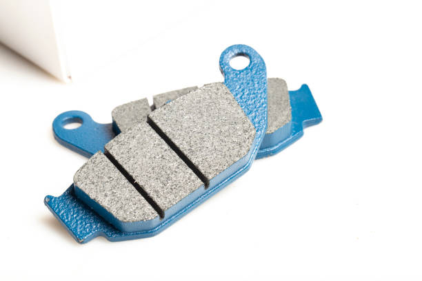 Motorcycle brake pads isolated on white background, close-up image