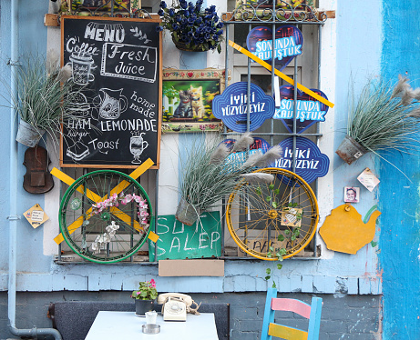 Balat, Istanbul, Turkey - November 13, 2022: cafe wall decorated with blue tones and various flowers in Balat.