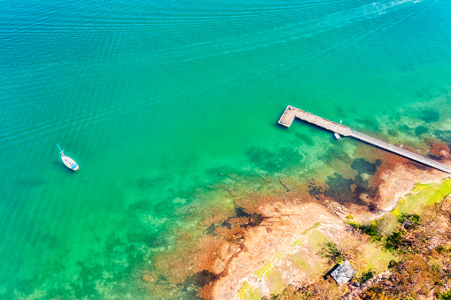 Clean transparent waters of Lake Macquarie in Australia at Murrays beach holiday resort.