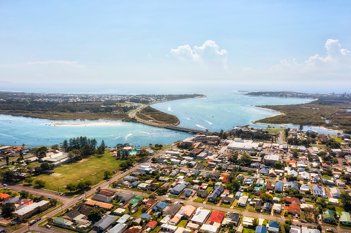 Aerial view of Swansea channel town and bridge on Pacific coast of NSW, Australia at Lake Macquarie entrance to the sea.