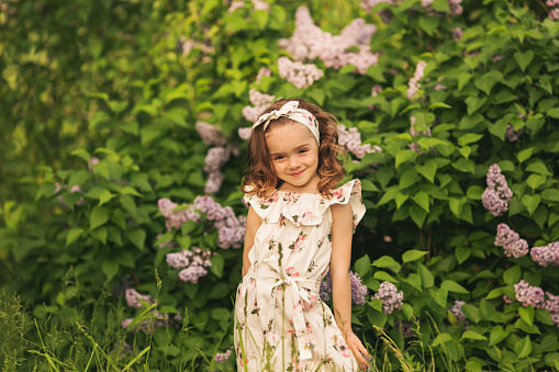 Face fashion little girl or kid in your web site. Little girl face portrait in Girl child brush hair in fashionable dress. Hairdresser and shampoo. Beauty and fashion, childhood, healthy hair