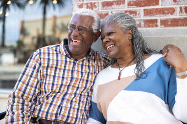 istock Senior black couple shopping downtown sitting on a bench 1462793854