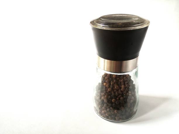 istock Pepper shaker and black peppercorn 1462796725