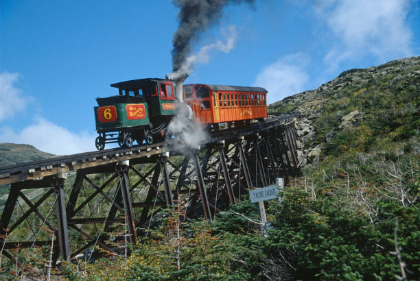 Mount Washington Cog Railway steam engine climbs Jacobs Ladder New Hampshire stock photo