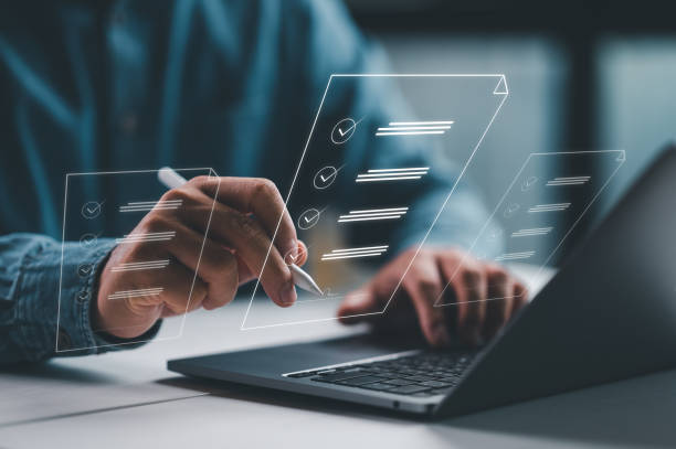 istock E-document management Paperless workplace, e-signing, electronic signature, document management man signs an electronic document on digital document by virtual notebook screen using a stylus pen. 1462809040