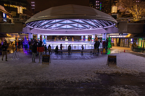 Vancouver, CANADA - Dec 18 2022 : Robson Square Ice Rink at evening, downtown Vancouver