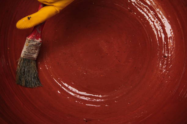 Person Painting Large Clay Vase