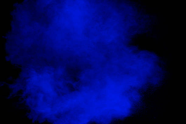 istock Blue powder explosion cloud on black background.Launched blue dust particle splash. 1462829989