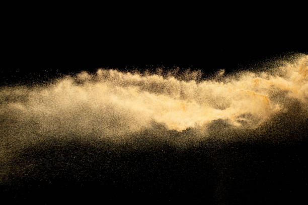 istock Abstract motion blurred brown sand background.Sandy explosion isolated on over dark background. 1462830015