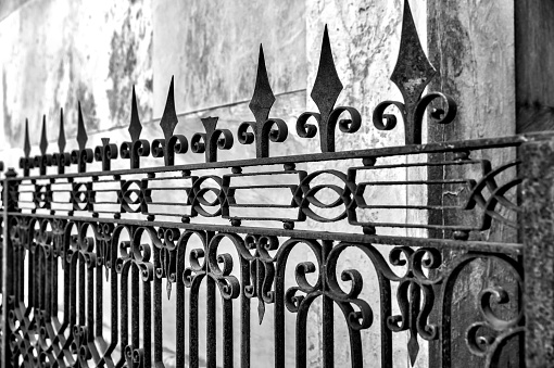 Buenos Aires, Argentina - December 21, 2022: Details of wrought iron fencing in La Recoleta Cemetery in Buenos Aires Argentina.