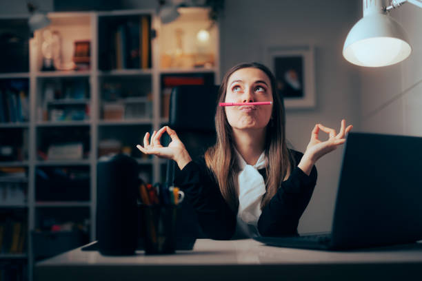 Funny Office Worker Procrastinating Feeling Bored Acting Silly stock photo