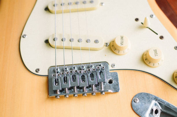 istock cool electric guitar on wooden background 1462841333