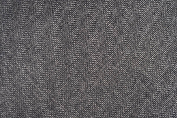 istock Jacquard woven upholstery, gray coarse fabric texture with diagonal weave lines, close up 1462841934