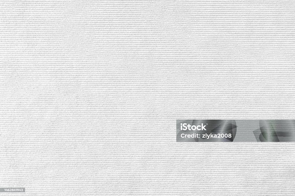 White velveteen upholstery fabric texture background. Texture background of velours white fabric. Upholstery velveteen texture fabric, corduroy furniture textile material, design interior, decor. Ridge fabric texture close up, backdrop, wallpaper. Textured Stock Photo