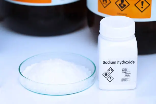 Photo of sodium hydroxide in bottle , chemical in the laboratory and industry