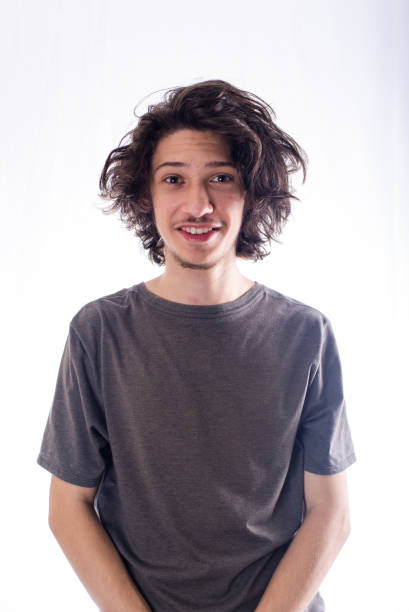 istock Handsome and cheerful young man smiling looking at camera. 1462842893