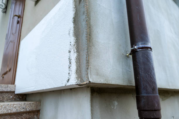 istock Installation of styrofoam insulation sheets on house facade wall for thermal protection. 1462900570