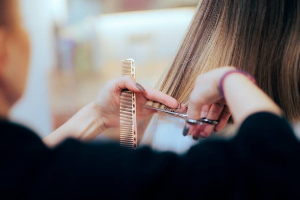 Hairdresser Doing a Precise Haircut Using Professional Tools