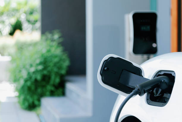EV car plugged-in with cable from progressive home charging station.