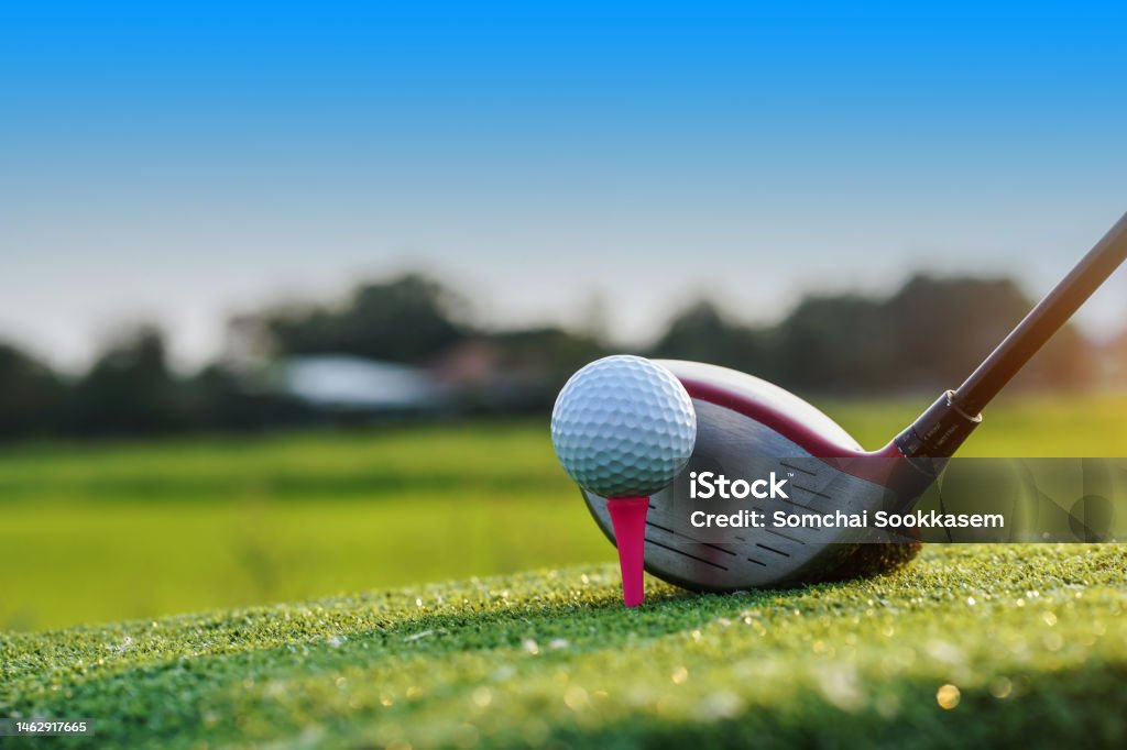 Golf balls on the golf course with golf clubs ready for golf in the first short. Golf balls on the golf course with golf clubs ready for golf in the first short. In the morning, with the beautiful sunlight. Golf Stock Photo