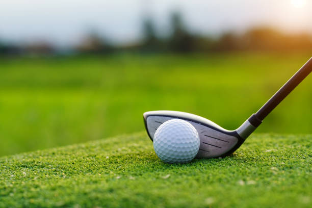 istock Golf balls on the golf course with golf clubs ready for golf in the first short. 1462918234